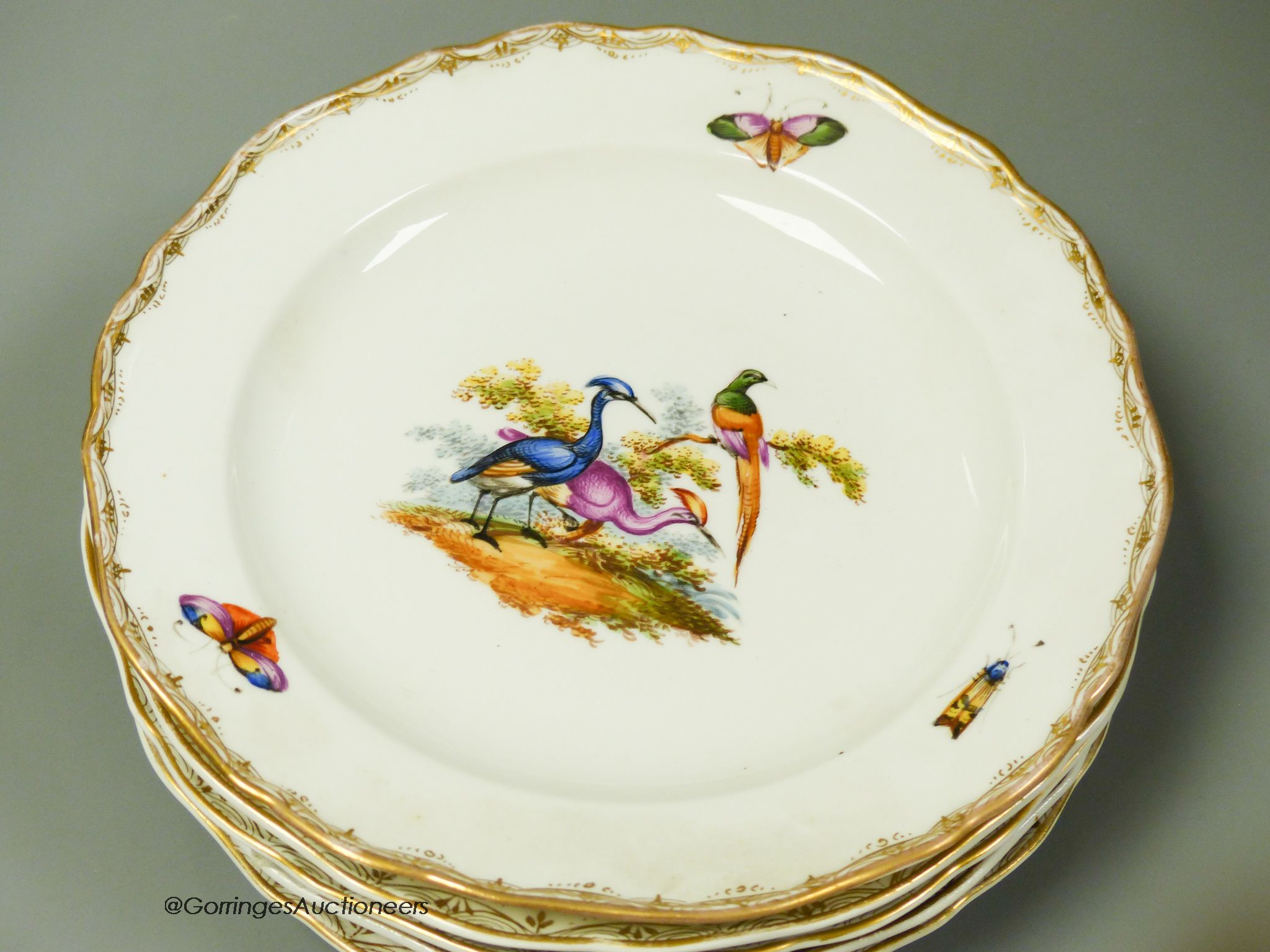 A set of six Meissen dessert dishes, painted with birds,factory seconds, 25.5cm diameter